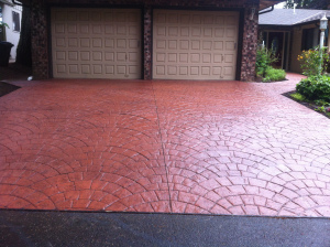 High-quality stamped and colored concrete driveway installation